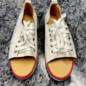Size 8 ladies peep tie tennis shoes. Never worn. White with red stripe.